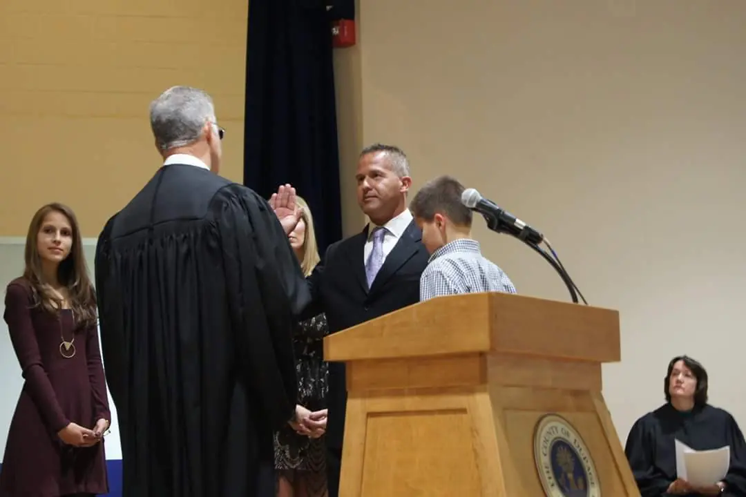 Sean Noonan taking the oath of office with his family